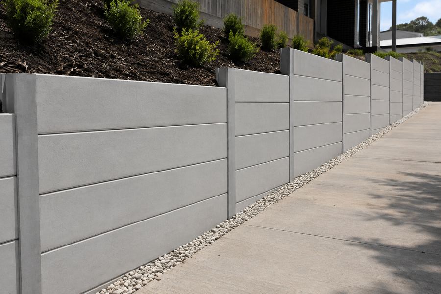 Precast concrete panel retaining wall